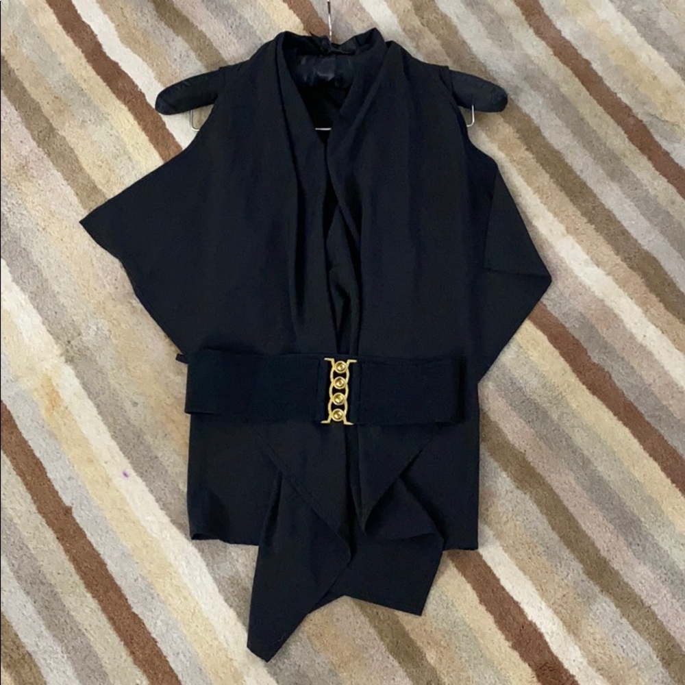 Black sleeveless top. Belt closure - removable